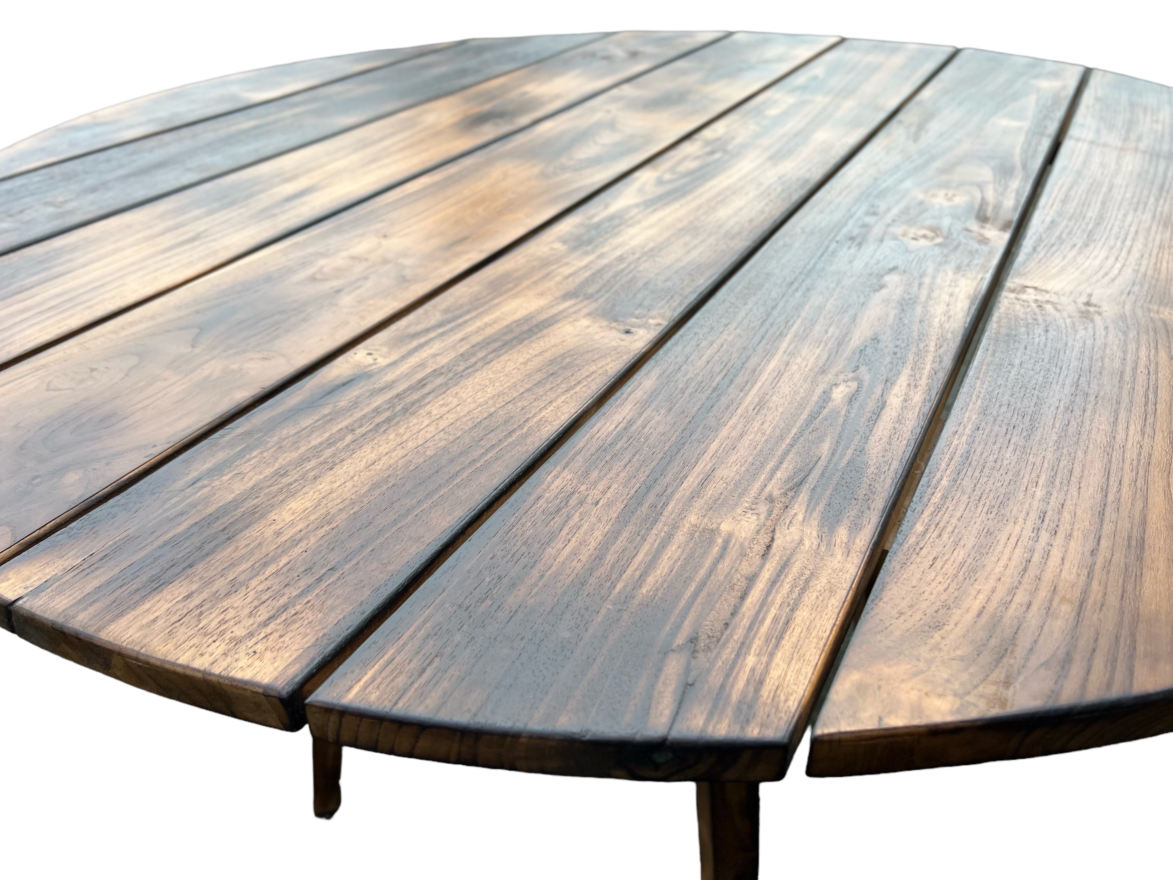 Handmade teak garden table - Unique piece with natural flair for indoors and outdoors - Flamed - 120 and 150 cm diameter - 80 cm high 