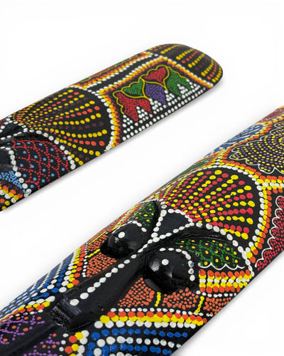 Unique piece: Handmade teakwood mask with a colorful polka dot pattern